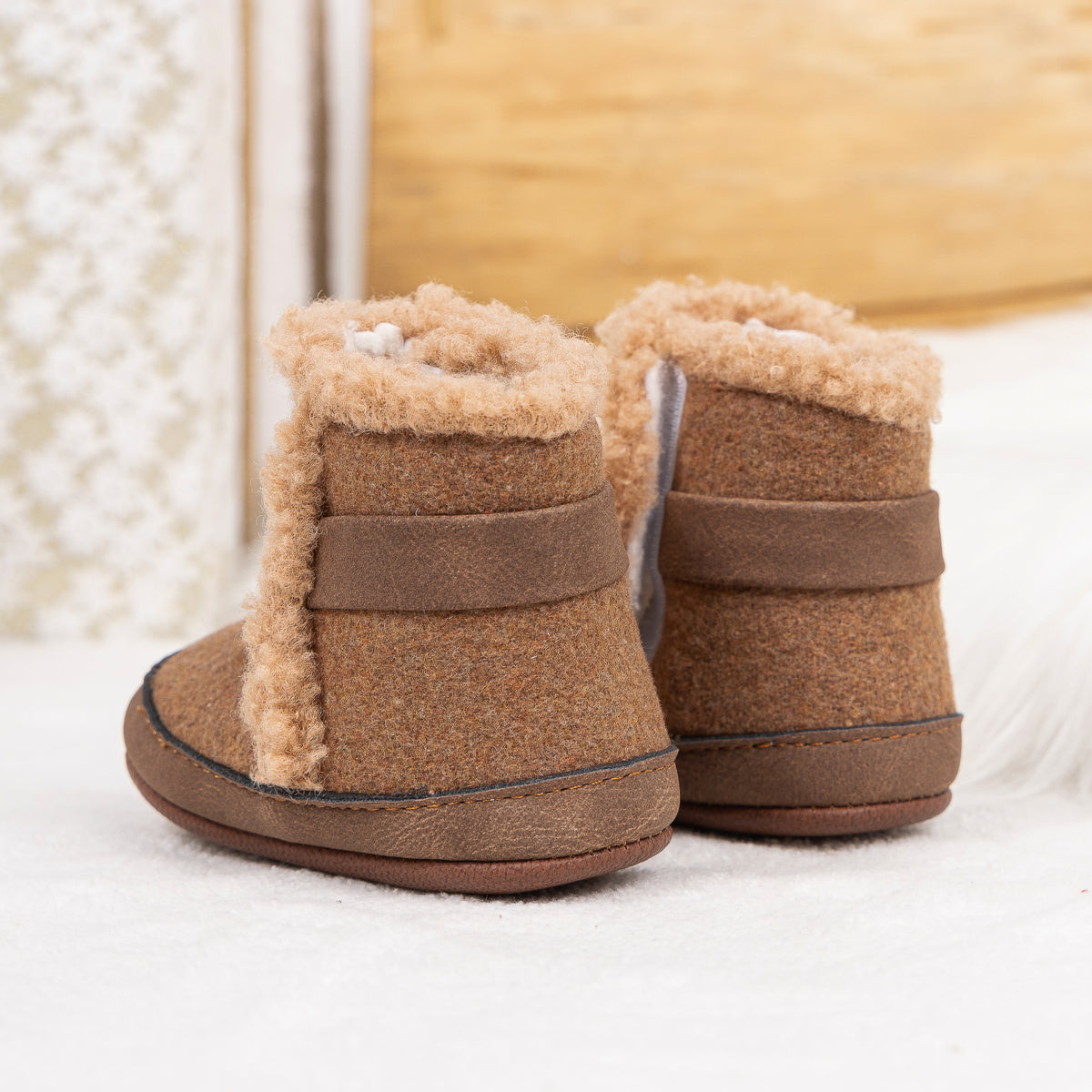 Brown faux fur baby boots. CG5402