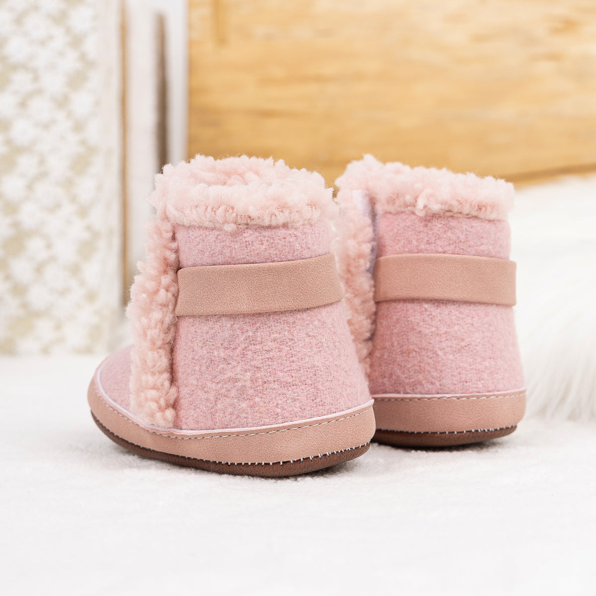 Brown faux fur baby boots. CG5402