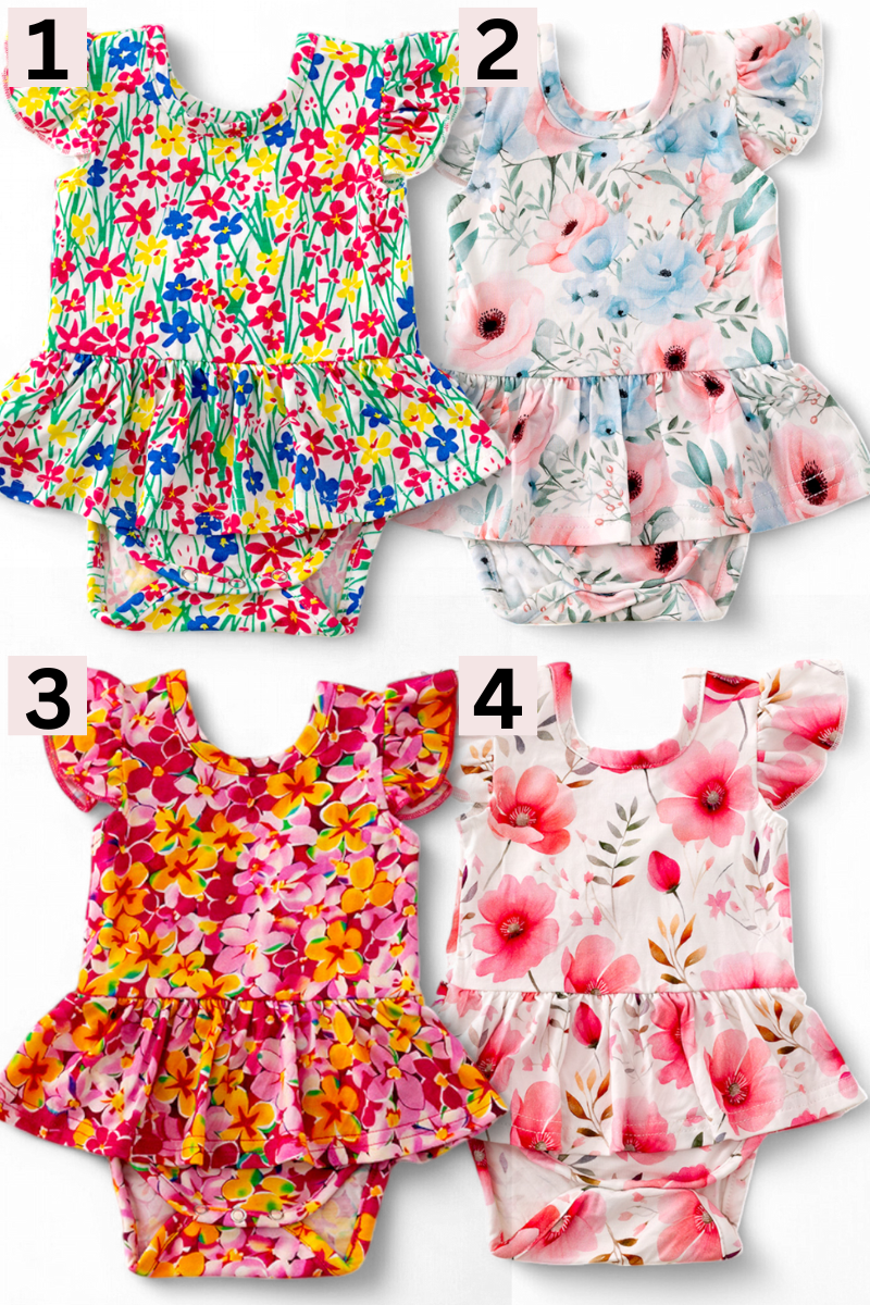 Multi-Printed girls baby onesies with snaps.