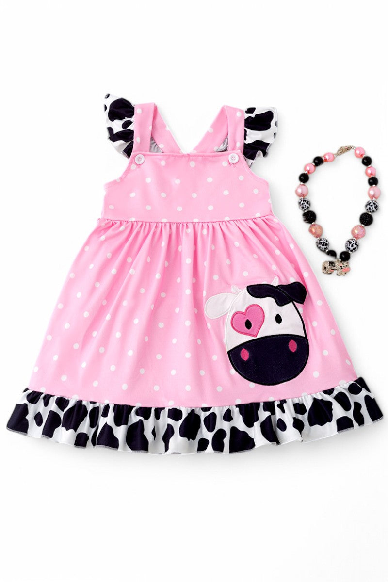 Cow application dress with polka dot print.