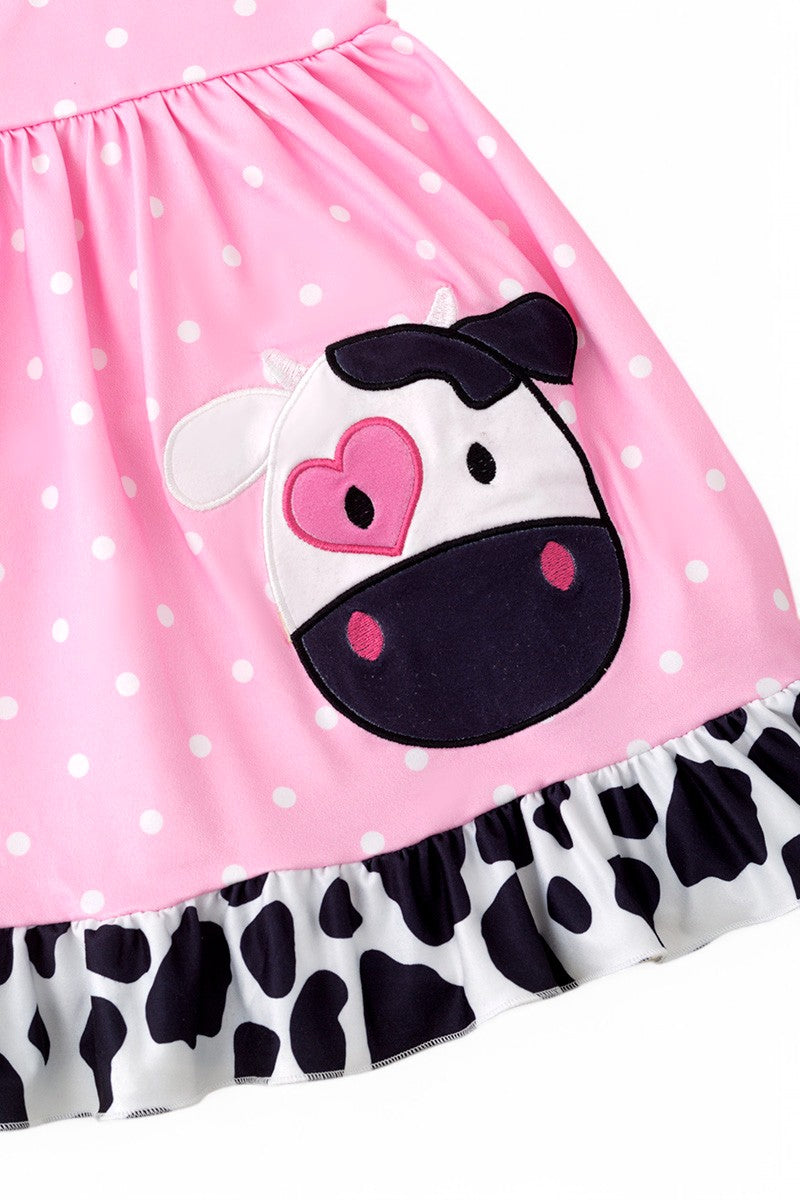 Cow application dress with polka dot print.