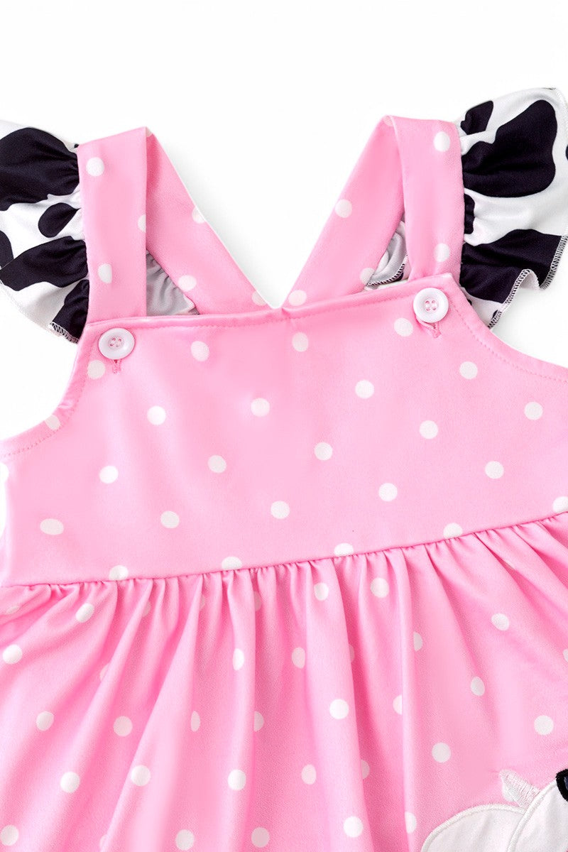 Cow application dress with polka dot print.