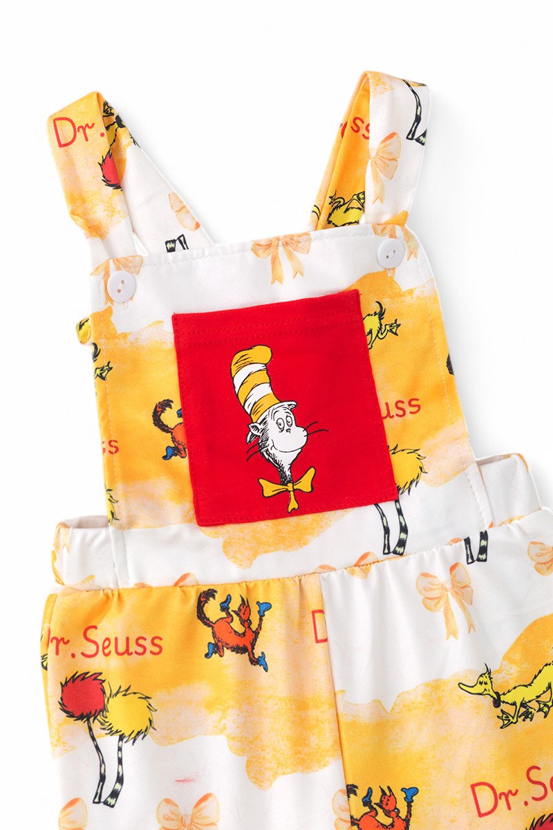 Yellow Dr Seus* printed romper with faux fur bells.