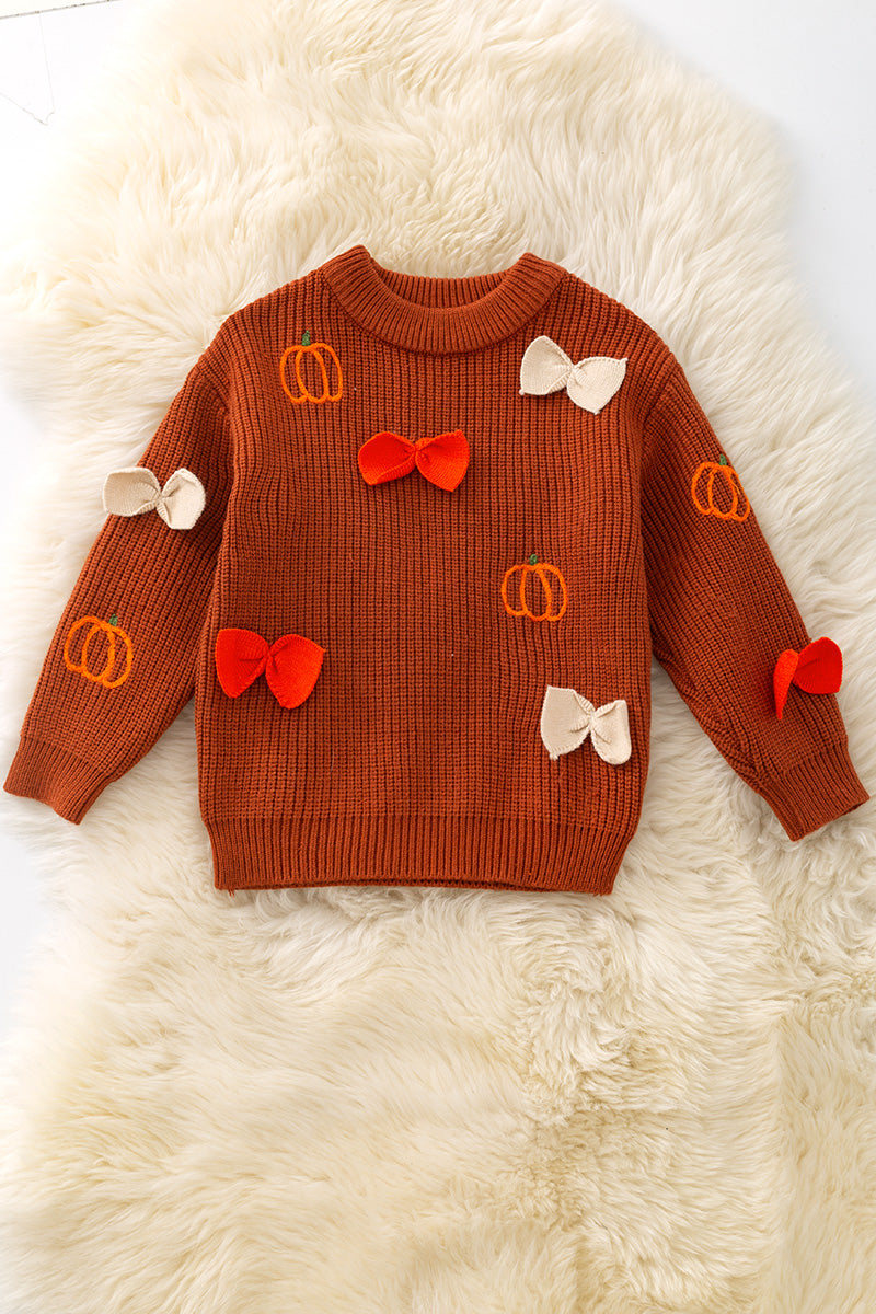 Brown pumpkin and bow knit pullover sweater.