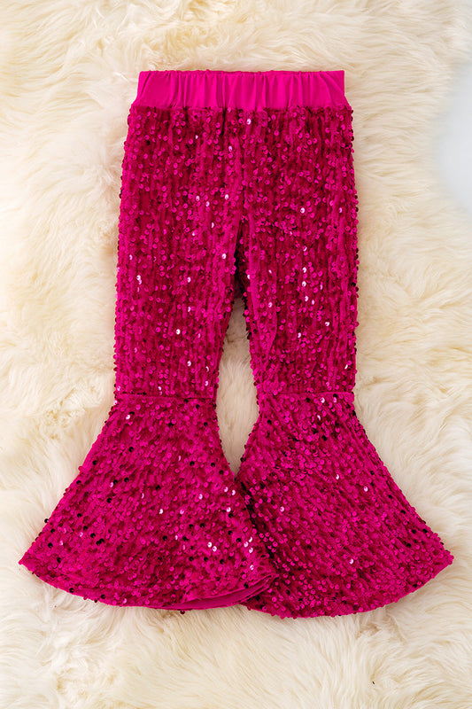 Fuchsia pants with sequins.