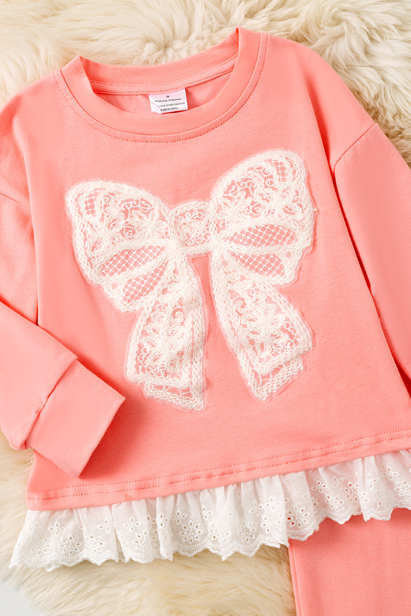Lt. Coral Cream lace bow and ruffle hem and coral pants. OFG61397 SOL