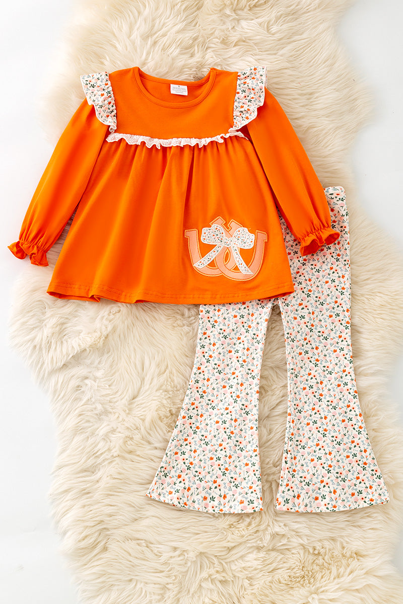 Orange Shoe horse applique tunic and floral pants. OFG61401