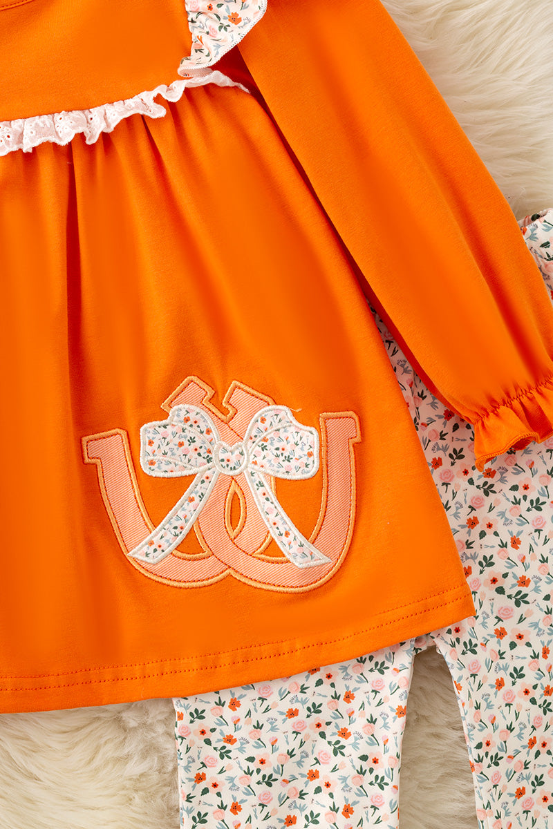 Orange Shoe horse applique tunic and floral pants. OFG61401