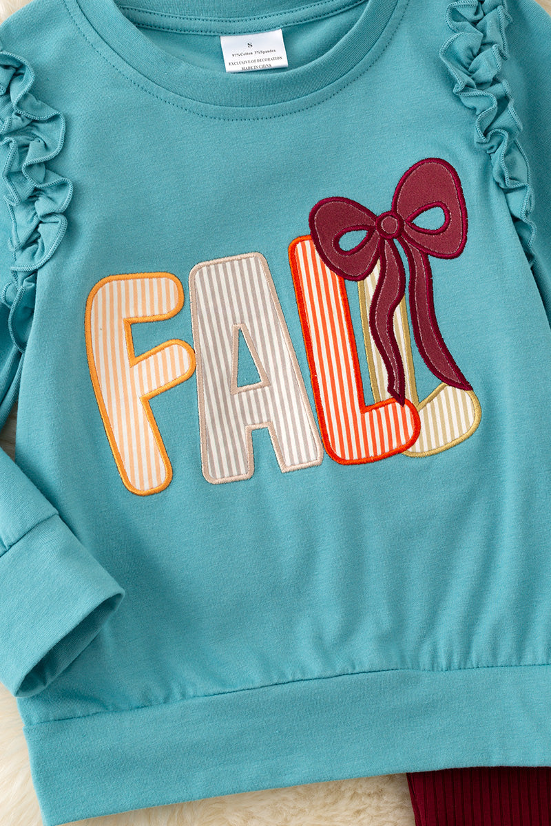 Fall applique on blue sweatshirt with burgundy pants w/open front. OFG61413