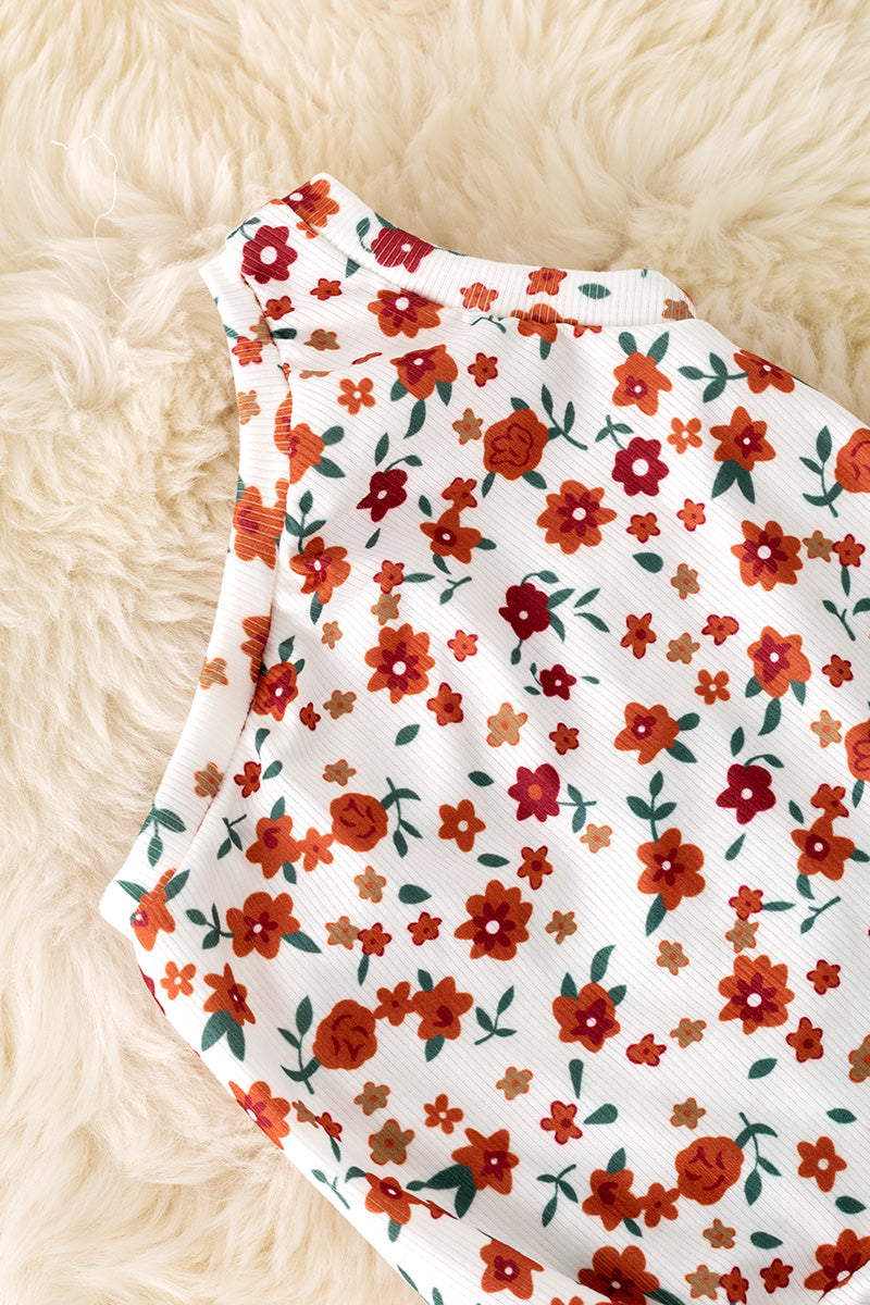 Cold shoulder ditsy floral bodysuit with snaps.