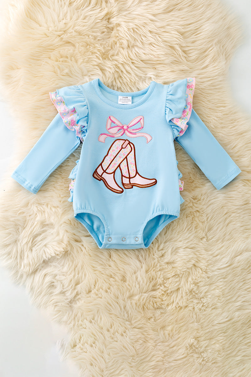 Lt blue boots applique baby bodysuit with floral ruffle on sleeves and ruffle butt. RPG61922 SOL