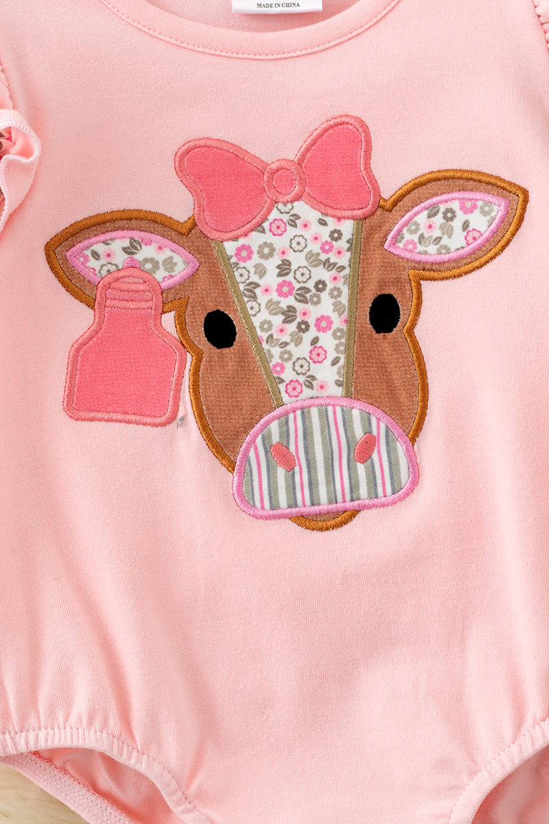 Pink cow applique baby bodysuit with floral ruffle on sleeves and ruffle butt. RPG61924 SOL