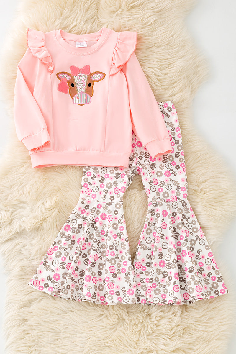 Cow applique on pink sweatshirt with floral bell bottoms. OFG61399 AMY