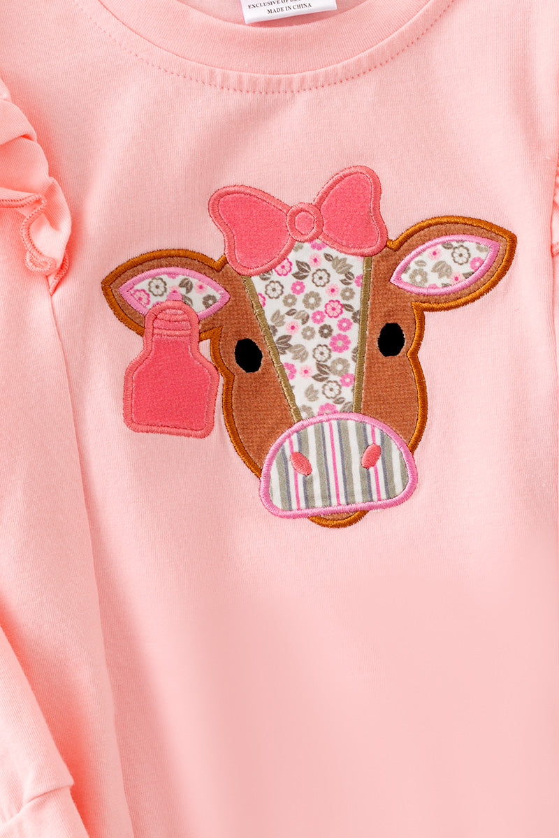 Cow applique on pink sweatshirt with floral bell bottoms. OFG61399 AMY