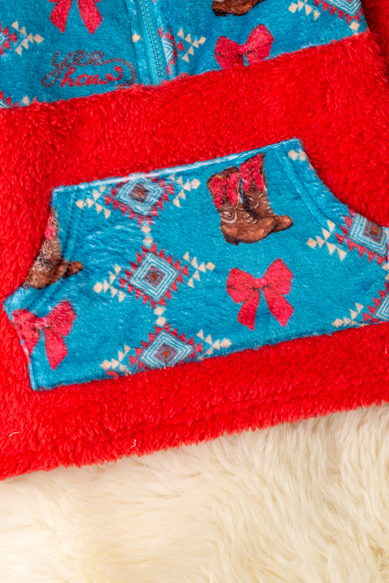 Sherpa Western printed on red pullover sweater.