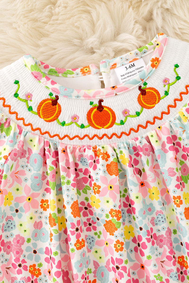 Floral smock baby romper with snaps. RPG62710