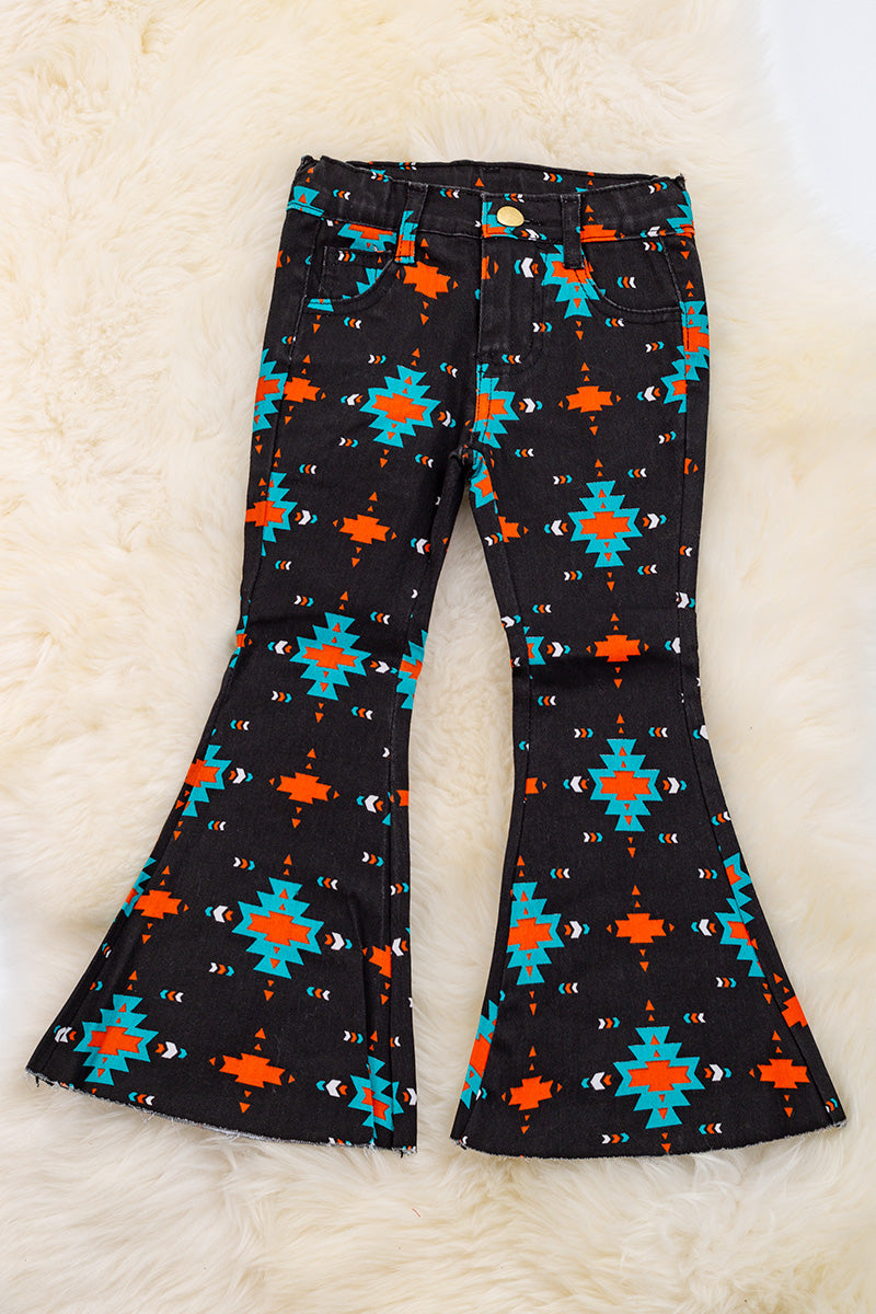 Black Aztec printed boot cut denim pants.