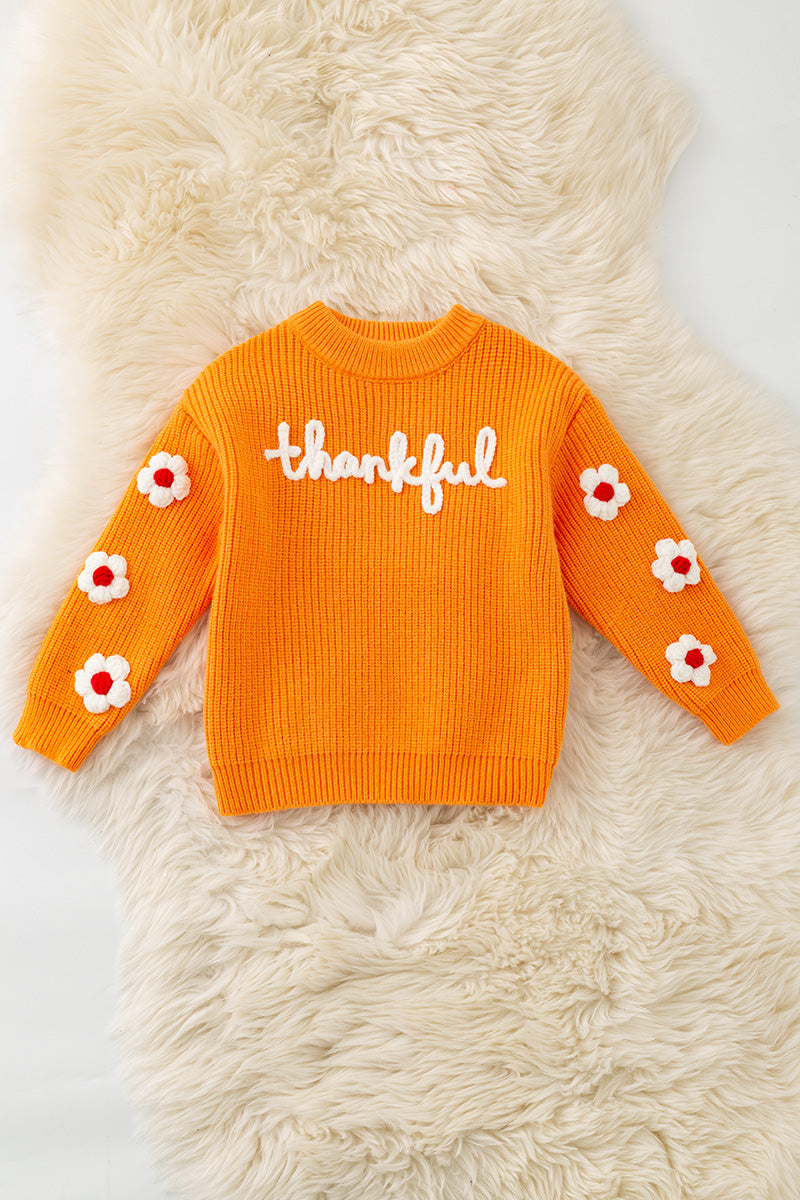 Orange Thankful knit sweater with embroidered flowers on sleeves. TPG60420 -M-