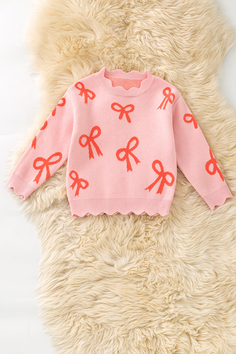 Coral bow on pink pullover knit sweater w/ scalloped hem. TPG60463 -A-