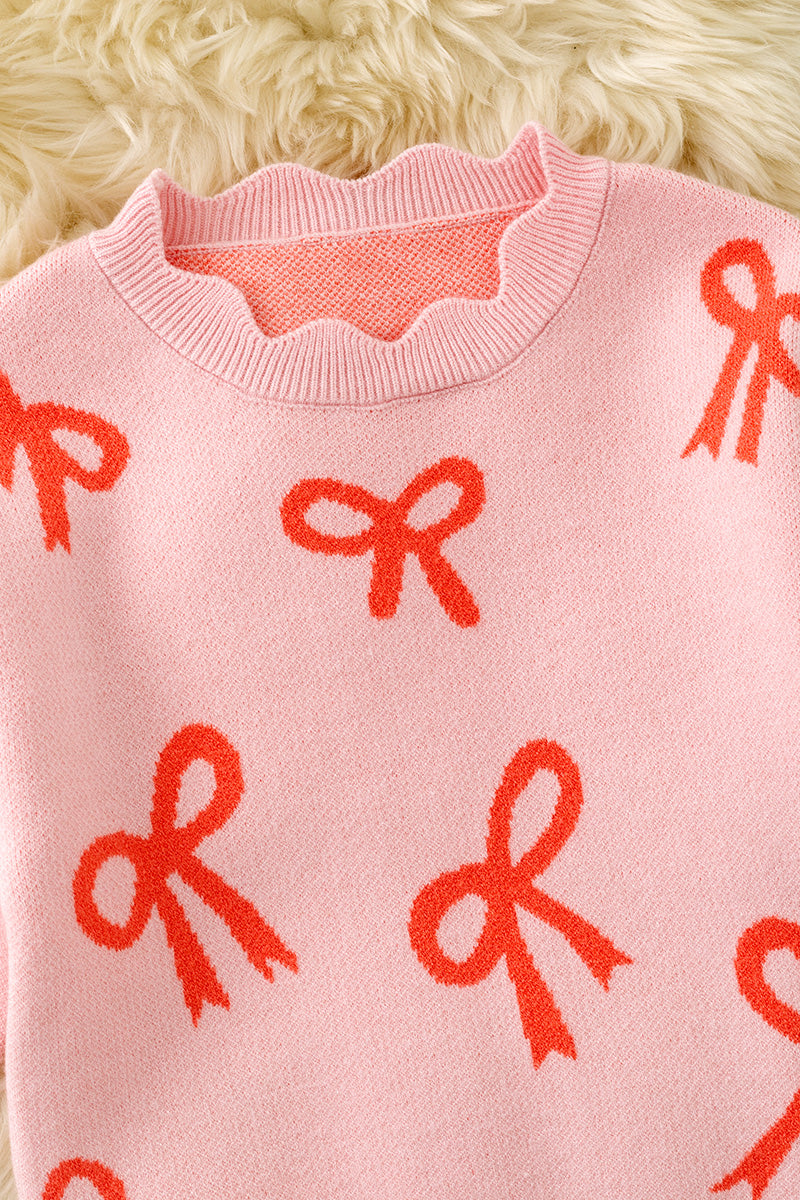 Coral bow on pink pullover knit sweater w/ scalloped hem. TPG60463 -A-