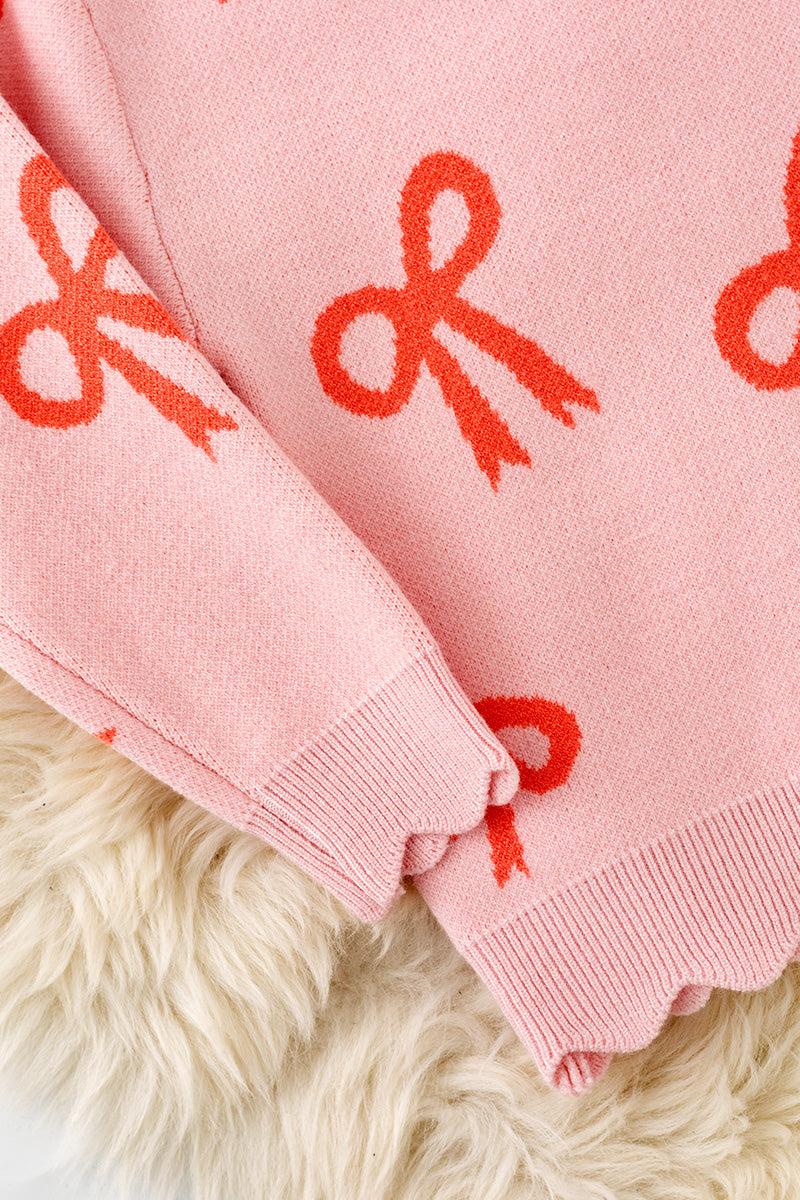 Coral bow on pink pullover knit sweater w/ scalloped hem. TPG60463 -A-