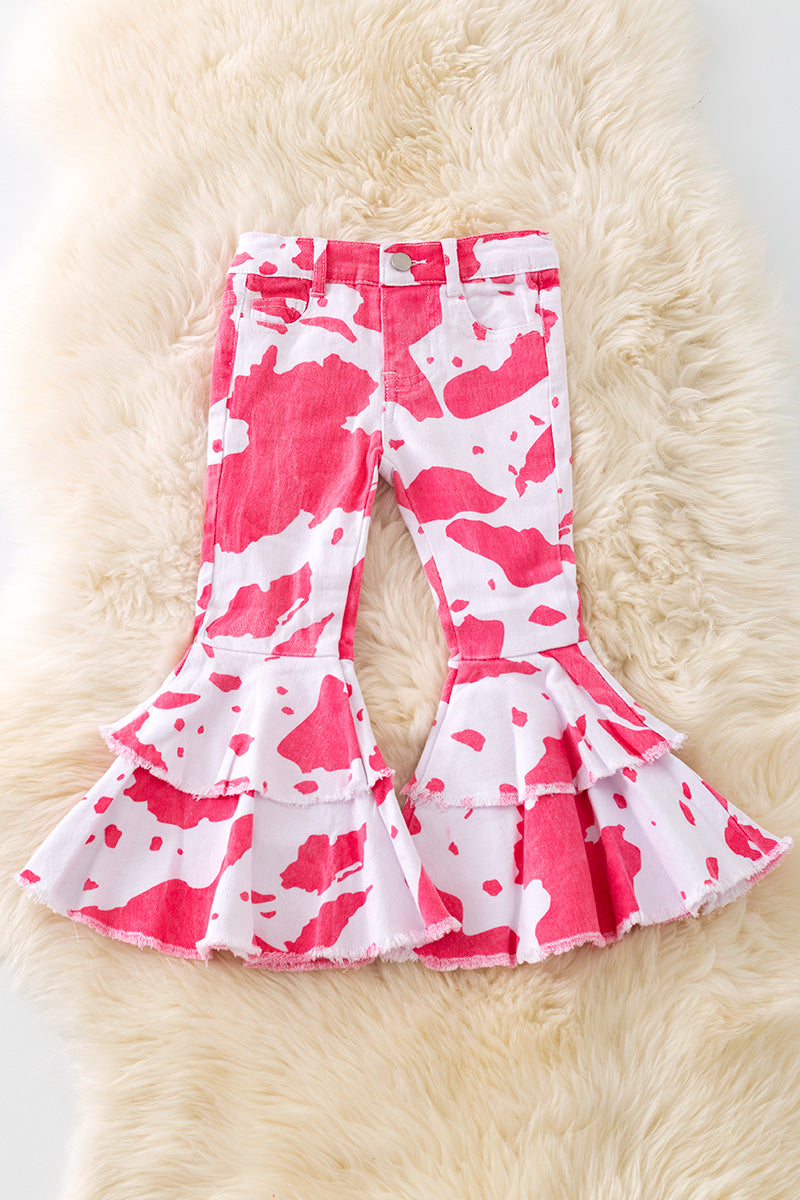 Pink cow spotted denim bell pants with adjustable waistband.