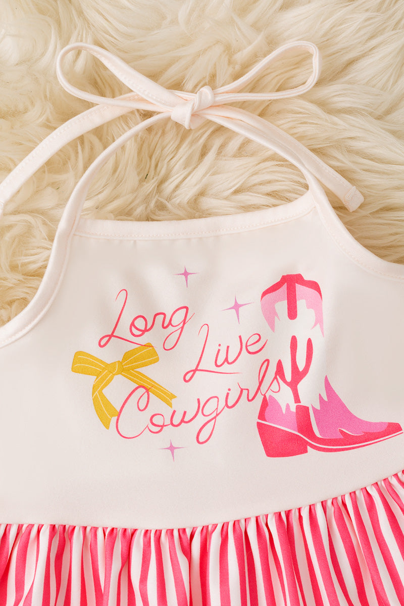 Long live cowgirls" halter top & bell bottoms.