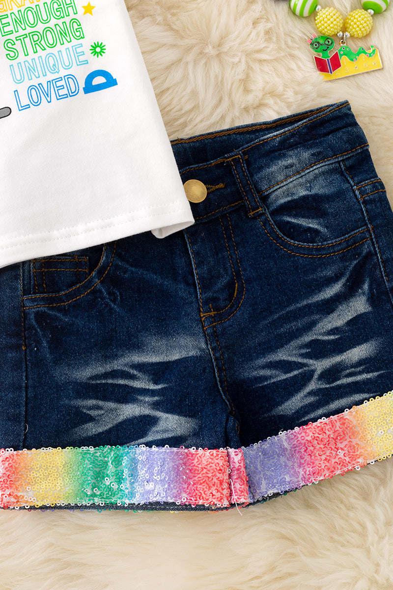 "You are kind, brave" white top w/ bubble sleeves and denim shorts.