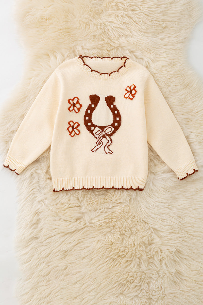 Horse shoe on cream knot pullover sweater w/moon stitch. TPG60491 -S-