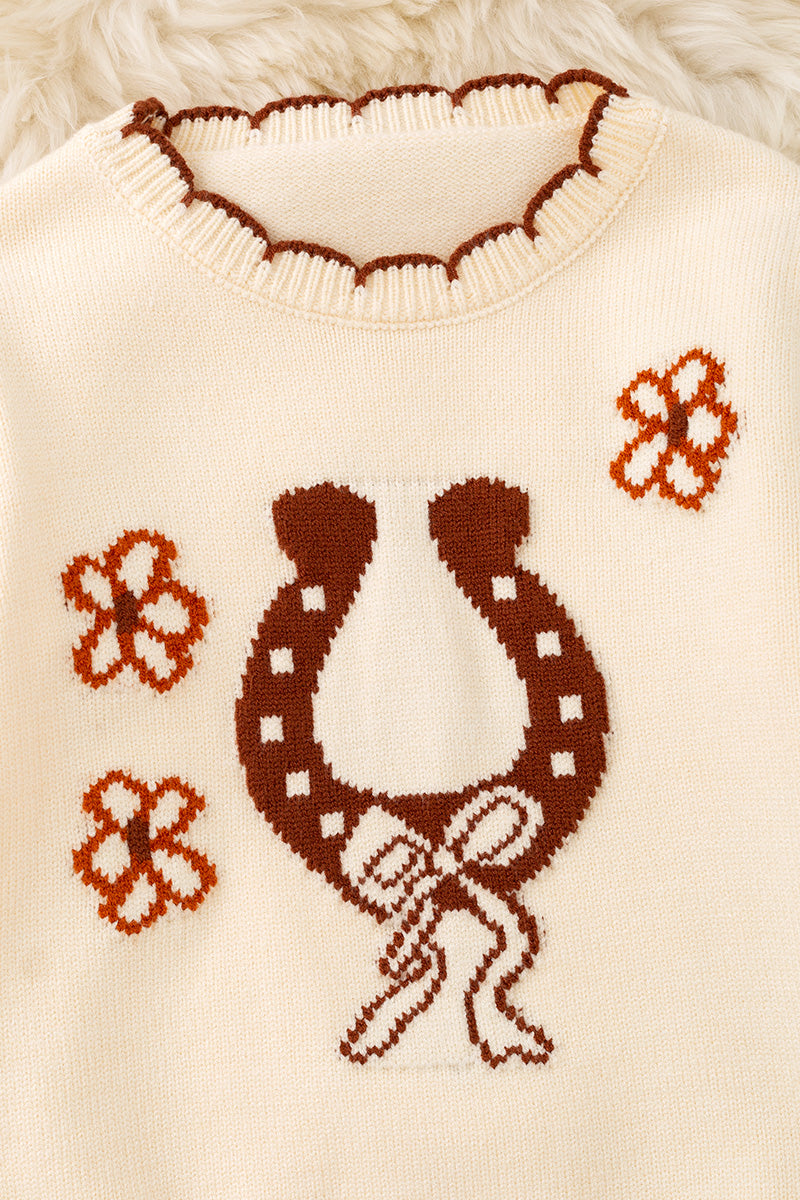 Horse shoe on cream knot pullover sweater w/moon stitch. TPG60491 -S-