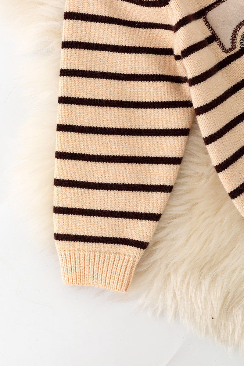 Unisex brown stripe on ivory knit sweater w/ pumpkin on a truck. TPG60458 A-