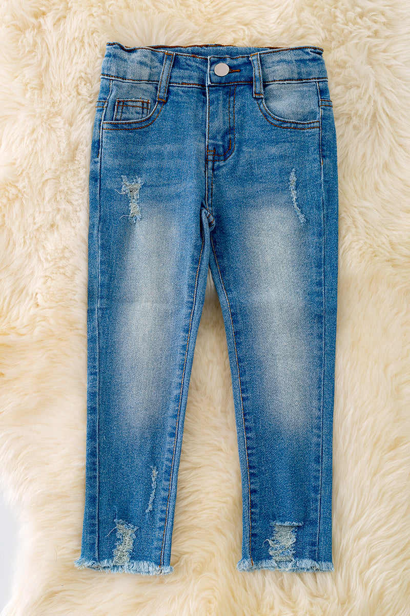 Bleached skinny jeans with distressed hem.