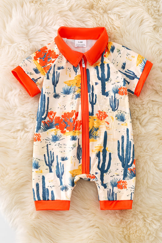Dry dessert on cream printed baby romper with orange trim. RPB50321