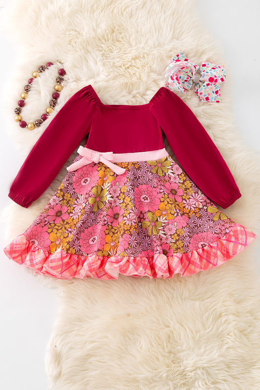 Maroon floral flare dress with ruffle hem.