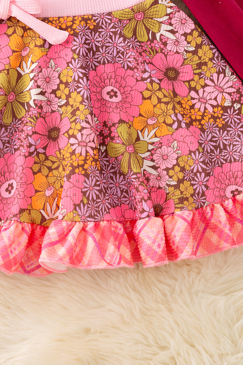 Maroon floral flare dress with ruffle hem.