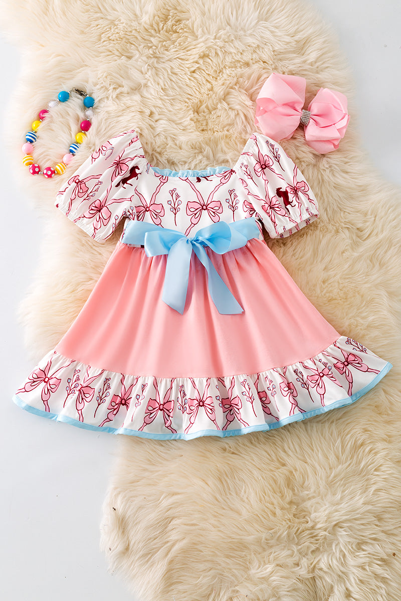 Pink Coquette western ruffle dress with blue front bow. DRG52448