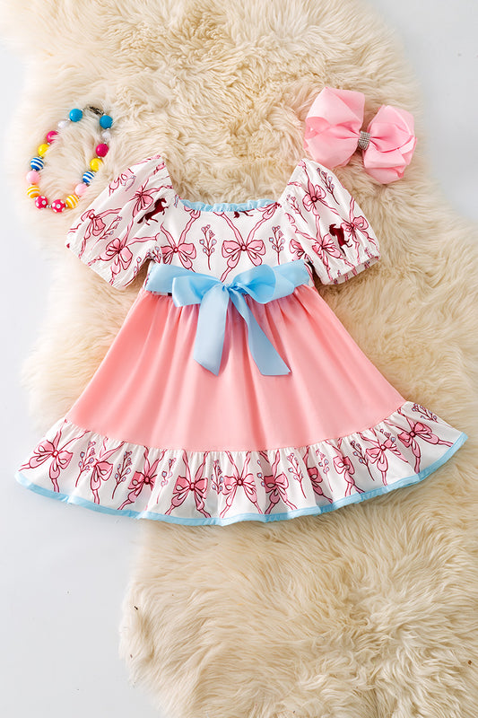 Pink Coquette western ruffle dress with blue front bow. DRG52448