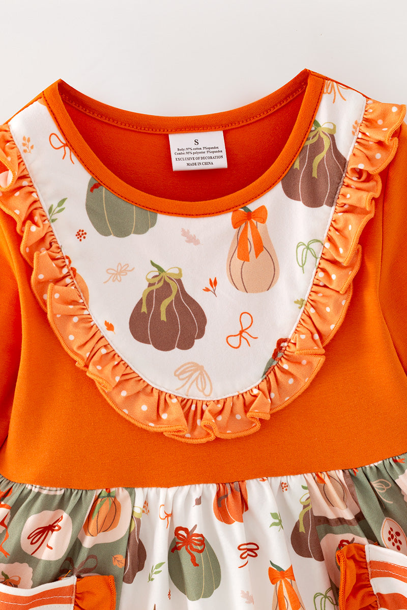 Orange tunic with printed pumpkins & stripe pockets & matching bell bottoms. OFG62383