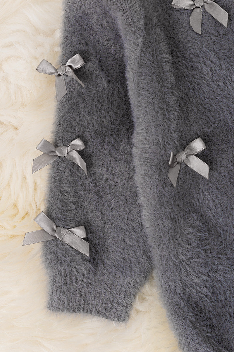 Gray button up cardigan with peal buttons.