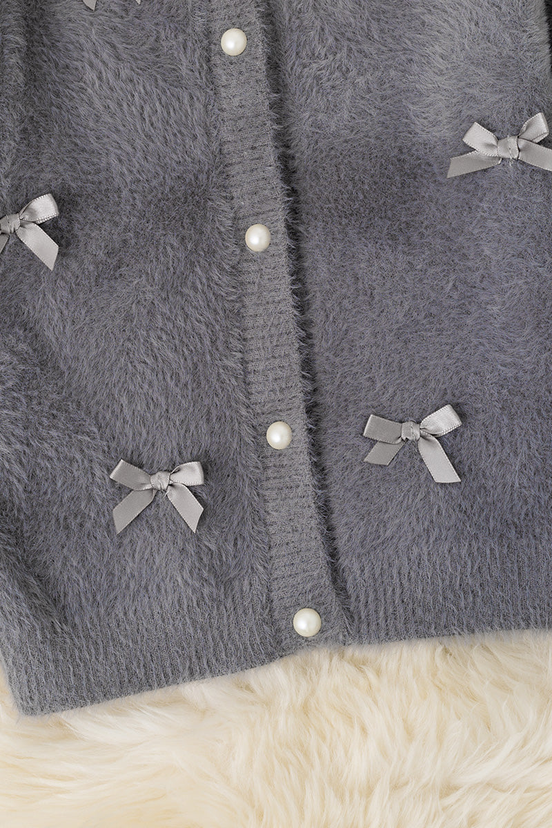 Gray button up cardigan with peal buttons.