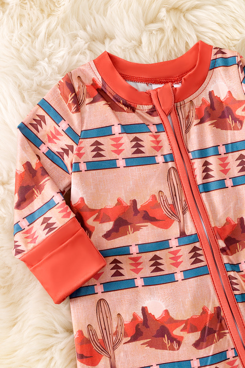 Dessert and aztec printed baby onesie with footie.