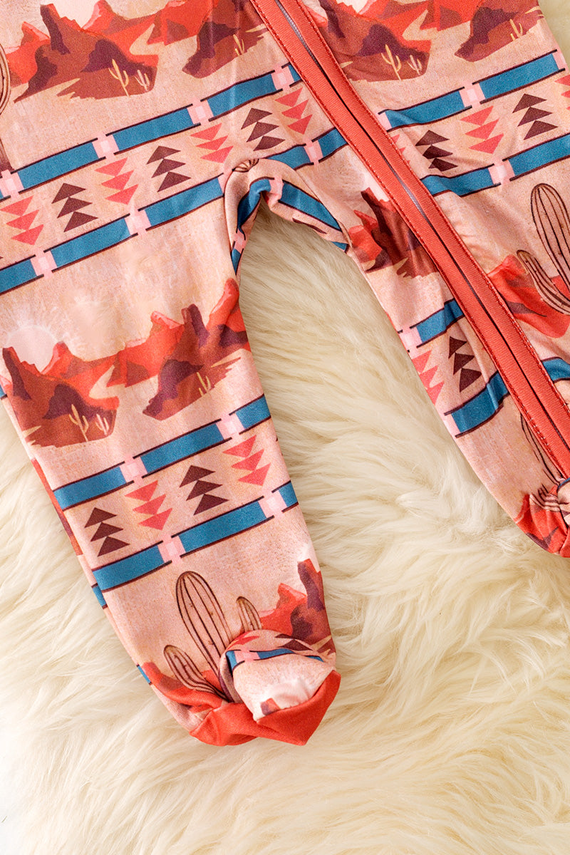 Dessert and aztec printed baby onesie with footie.