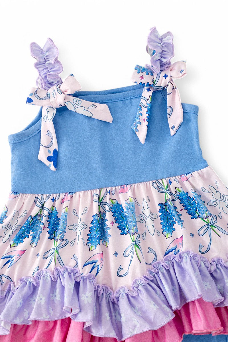 Bluebonnet printed ruffle tunic & blue shorts.