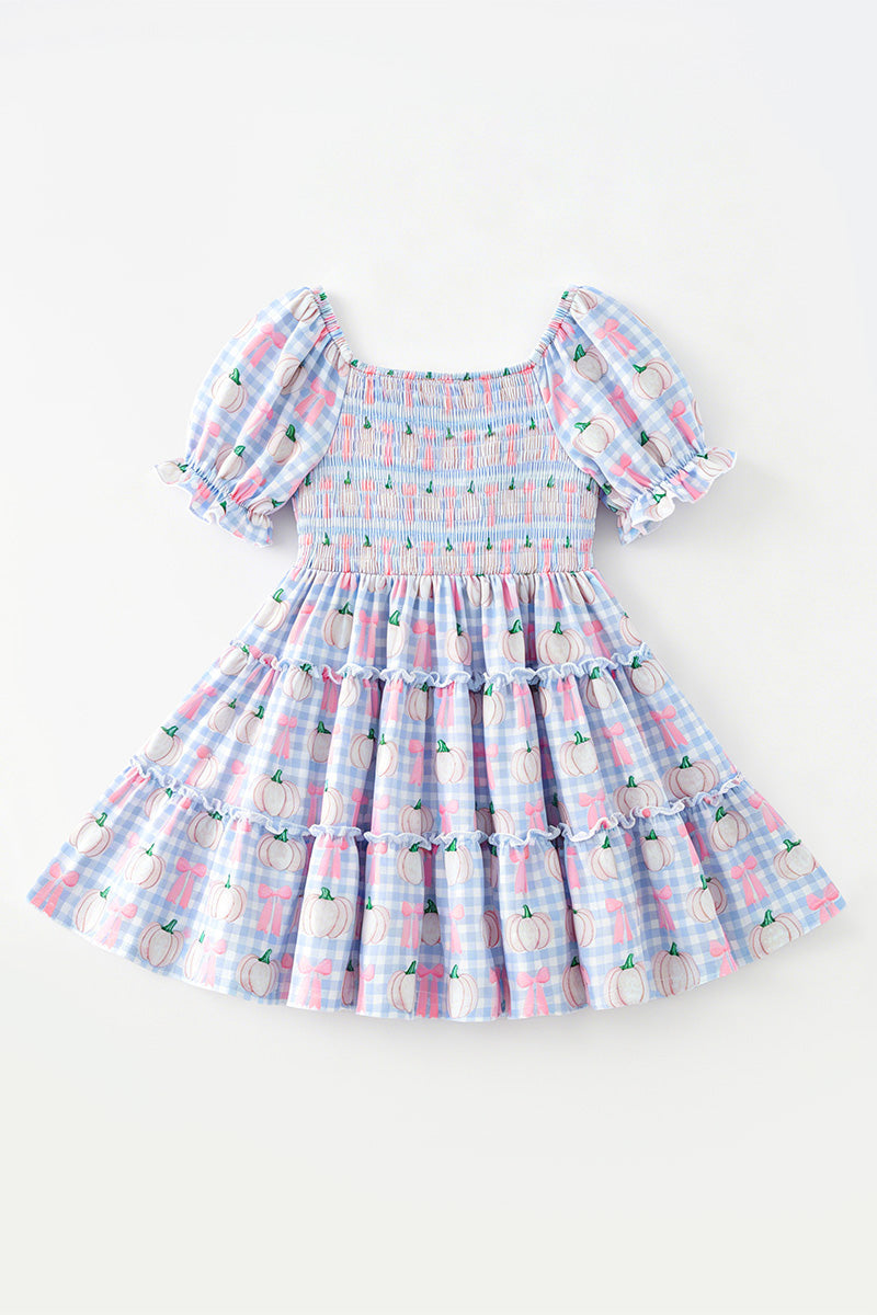 Blue gingham w/ pumpkin printed smocked tiered dress. DRG65299 SOL