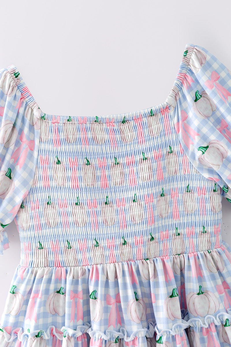Blue gingham w/ pumpkin printed smocked tiered dress. DRG65299 SOL