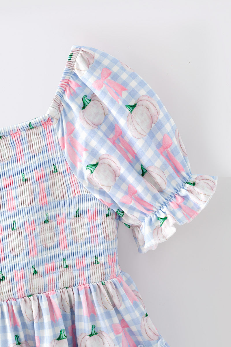 Blue gingham w/ pumpkin printed smocked tiered dress. DRG65299 SOL
