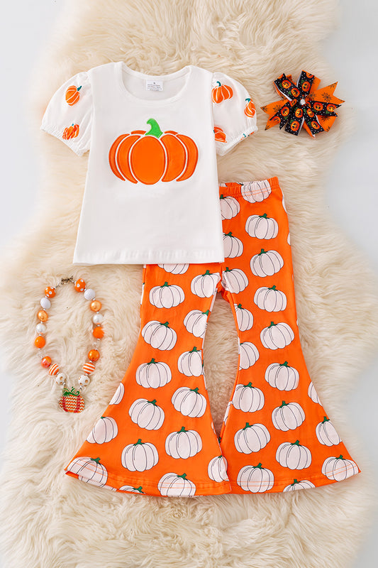 Pumpkin printed top and bell bottoms.