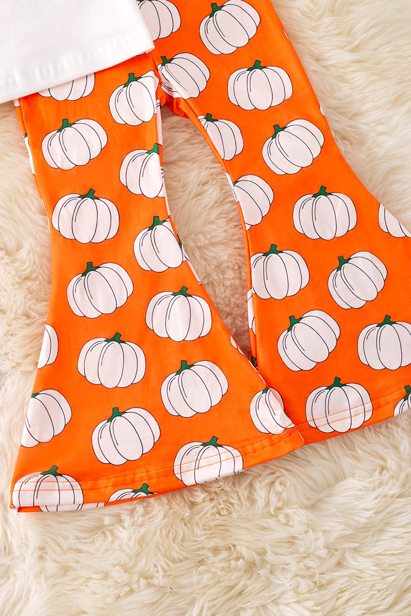 Pumpkin printed top and bell bottoms.