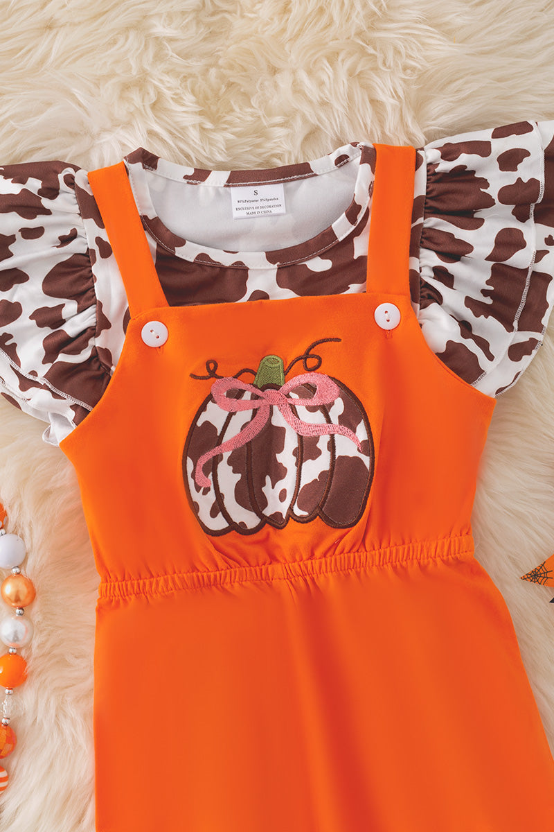 Orange jumpsuit with pumpkin applique and cow printed angel sleeve top.