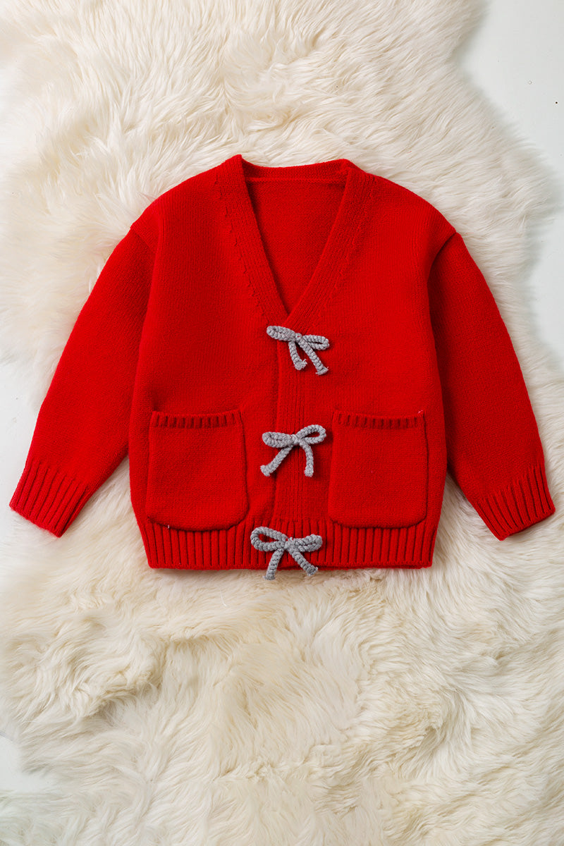 Red knit cardigan with front pockets.